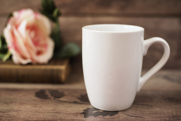 Mug Mockup. Coffee Cup Template. Coffee Mug Printing Design Template. White Mug Mockup, Old Book and Flower, Wooden Background. Blank Mug. Mockup Styled Stock Product Image