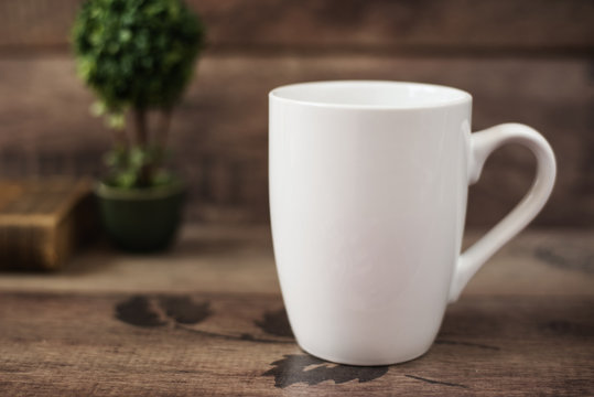  Mug Mockup. Coffee Cup Template. Coffee Mug Printing Design Template. White Mug Mockup, Old Book and Flower, Wooden Background. Blank Mug. Mockup Styled Stock Product Image