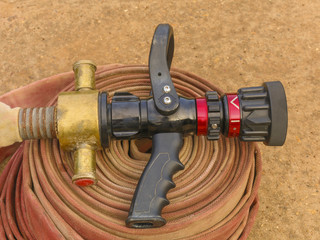 Water jet splashing from a fire fighting firehose nozzle