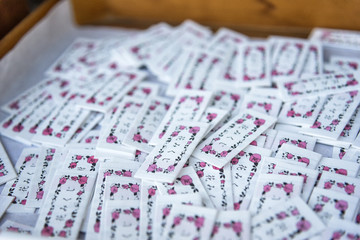 KUMAMOTO, JAPAN - FEB 18 : Small paper message, Japanese amulet for bring good health money and luck. sold in many shrines on February 18, 2016 in Fukuoka Japan