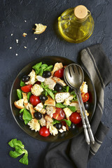 Italian salad panzanella with chicken and lamb`s lettuce.Top vie