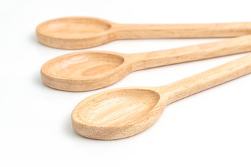 Wooden spoon isolated on a white background