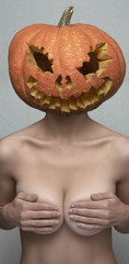 Nude Woman with Pumpkin and big Tits in her Hands