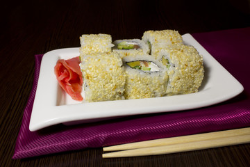 Beautifully decorated sushi on a plate.