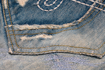 old jean on wooden desk table , part of jean,