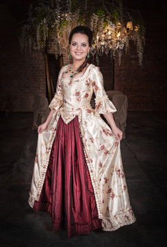 Beautiful woman in old historic medieval dress