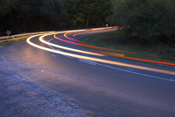 Car lights at night on the road.