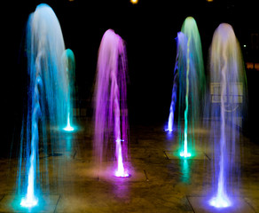 colored water fountain at night