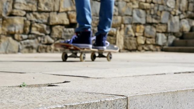 Close up detail view of a skater feet riding his skate board, sport and recreation lifestyle