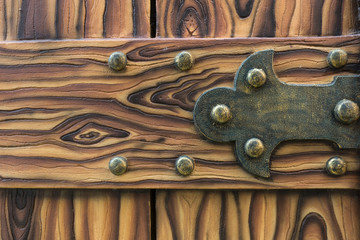 Rustic wooden door with symbolic patterns in old style, traditio