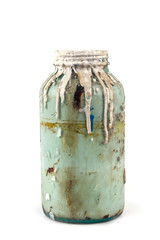 old container of paint on a white background