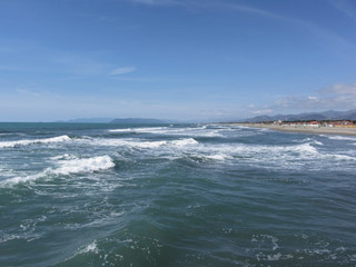 Waves of the sea on the sand beach. Forte dei marmi, Province of Lucca, Italy