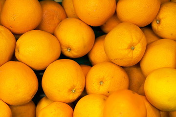 Lots of bright oranges in supermarket.