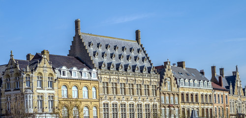 Fototapeta na wymiar Characteristic Flemish high pitch roof lines in the main square of Ypres (Ieper), Belgium