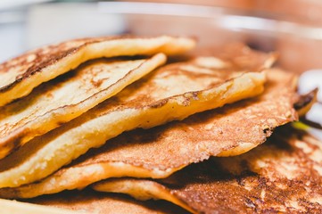 Pile of delicious american pancakes close up