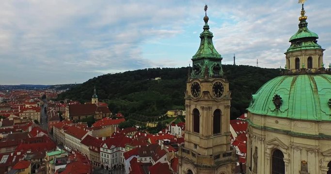 Very close fly over of the dome and the chapel at St. Michael's Cathedral in Prague, Czech Republic. Petrin gardens and old city.