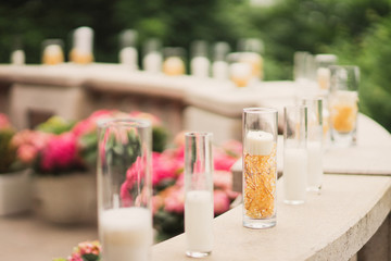 candles and flowers on the terrace at wedding reception