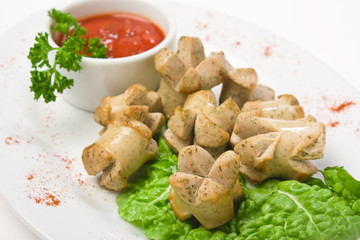 chopped sausages fried with vegetables