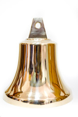 Handmade shiny bronze bell on white background
