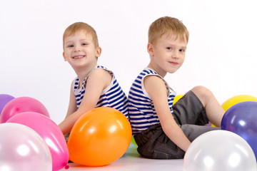 Fototapeta na wymiar Happy children with balloons, white background