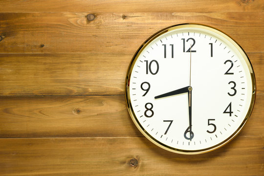 wall clock on the wooden wall