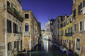 Fototapeta na wymiar Night Venice. Boats and stars on the night sky