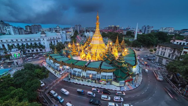 4K day to night time-lapse view of Sule Pagoda with traffic, a major landmark in Yangon, Myanmar