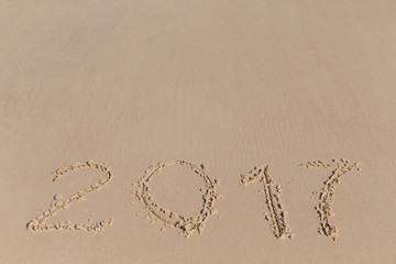 New 2017 Year sign on a sea coast sand