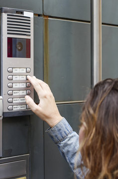 Woman  calling on the intercom