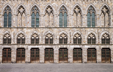 Exterior facade of the medieval Cloth Hall in Ypres (Ieper), Belgium, which was reconstructed between 1933 and 1967 following destruction in the World War I conflict - 124905589