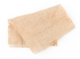 Burlap napkin isolated on white background. Top view.