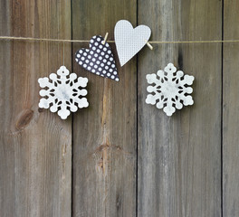 Handmade Jewelry on a wooden background. Christmas. Heart and sn