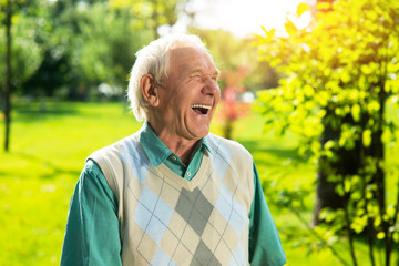 Senior man laughing. Elderly guy outdoor. Modern youth is so funny. Save the sense of humor.