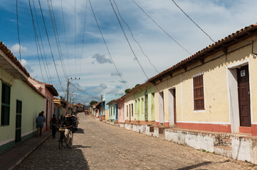 Fototapeta na wymiar Wires over street houses in residential area in Trinidad, Cuba