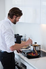 Man preparing a food in kitchen