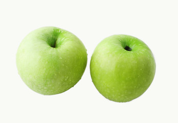 Two green apples on white background