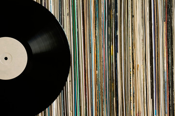 Vinyl record on a collection of albums - 124912173