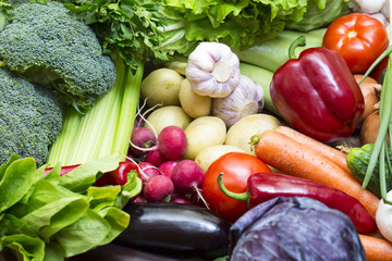 Background of fresh vegetables and greens closeup