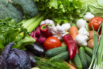 Background of fresh vegetables and greens closeup