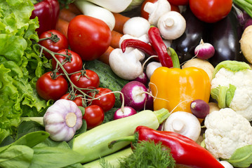 Background of fresh vegetables and greens closeup