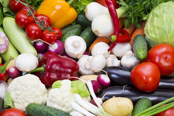 Background of fresh vegetables and greens closeup