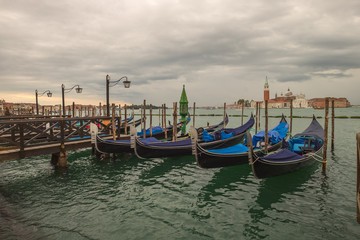 Fototapeta na wymiar Traditional Venetian gondola - with San Giorgio Maggiore church. San Marco, Venice, Italy