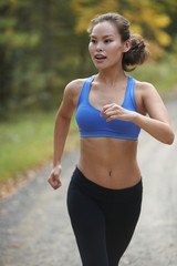 Fototapeta premium Asian Beauty running in woods