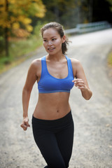 Fototapeta premium Asian Beauty running in woods