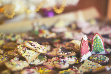 drying Mixed Christmas cookies under the Xmas tree, soft focus