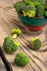 Healthy Green Organic Raw Broccoli Ready for Cooking.on wooden table.selective focus