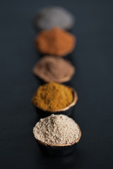 Various spices on black
