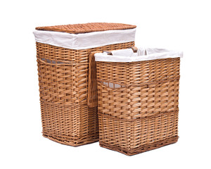 Natural wicker laundry basket isolated on white background