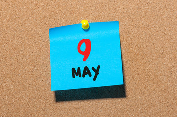 May 9th. Day 9 of month, calendar on cork notice board, business background. Spring time, empty space for text