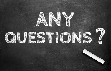 Chalk and ANY QUESTIONS write on chalkboard background
